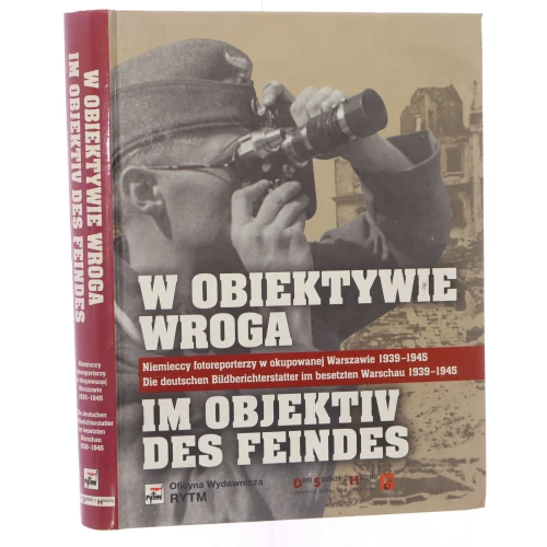 W obiektywie wroga niemieccy fotoreporterzy w okupowanej Warszawie 1939-1945 wybór i oprac. zdj. oraz materiału źródłowego, tekst koment. Danuta Jackiewicz, Eugeniusz Cezary Król aut. art. Eugeniusz Cezary Król et al. [2009]